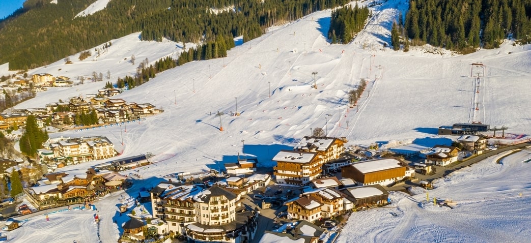 beautiful aerial shot town top snowy mountain min